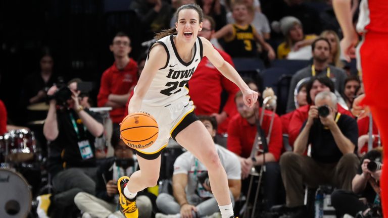 FILE - Iowa guard Caitlin Clark smiles after catching her 10th rebound to give her a triple-double against Ohio State in the second half of an NCAA college basketball championship game at the Big Ten women's tournament Sunday, March 5, 2023, in Minneapolis. Clark was honored as an All-American by The Associated Press on Wednesday, March 15, 2023. (AP Photo/Bruce Kluckhohn, File)