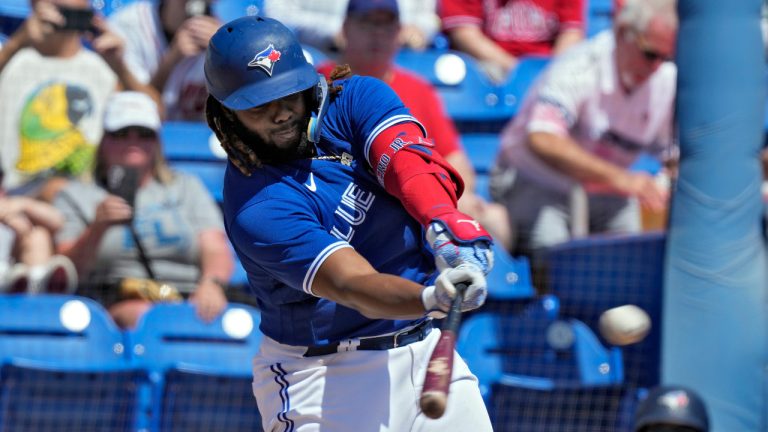 Toronto Blue Jays' Vladimir Guerrero Jr. flies out to center field off Philadelphia Phillies pitcher Matt Strahm during the first inning of a spring training baseball game Friday, March 17, 2023, in Dunedin, Fla. (Chris O'Meara/AP) 