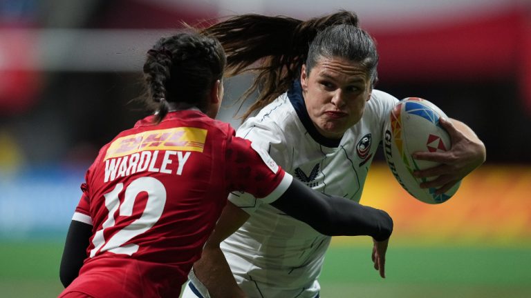 United States' Ilona Maher, back right, runs the ball past Canada's Keyara Wardley during HSBC Canada Sevens women's rugby action, in Vancouver, on Friday, March 3, 2023. (Darryl Dyck/CP)