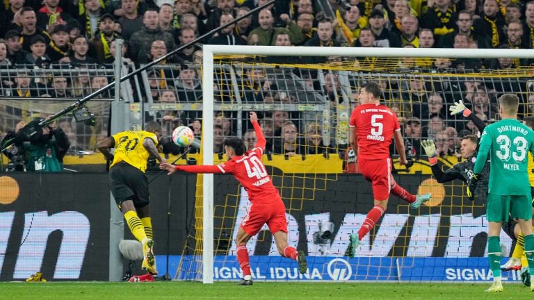 Dortmund's Anthony Modeste, left, scores his side's second goal during the German Bundesliga soccer match between Borussia Dortmund and Bayern Munich in Dortmund, Germany, Saturday, Oct. 8, 2022. (Martin Meissner/AP Photo)