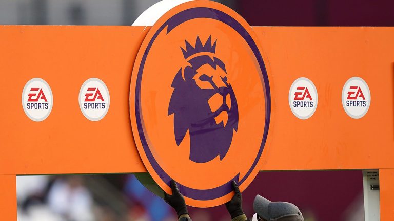 A board with the Premier League logo and EA Sports sponsor is erected on the pitch before the Premier League match at the London Stadium, London. Picture date: Sunday January 16, 2022.