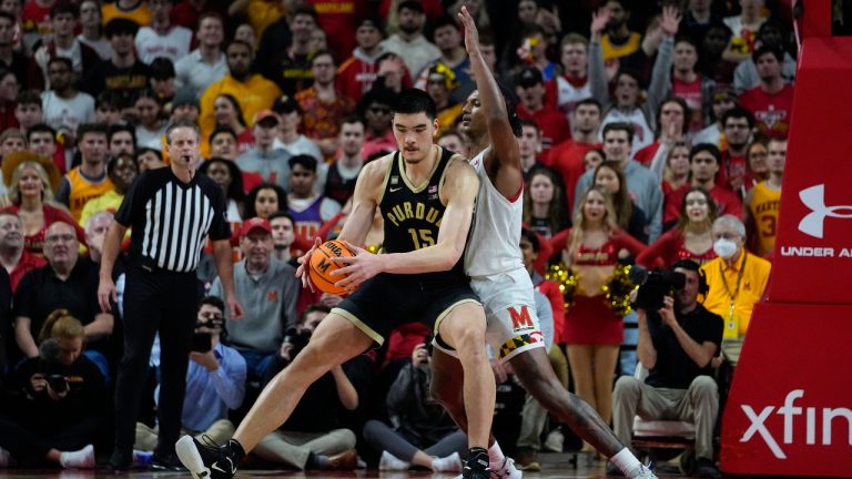 Purdue center Zach Edey, left, works his way toward the basket against Maryland forward Julian Reese during the second half of an NCAA college basketball game, Thursday, Feb. 16, 2023, in College Park, Md. Maryland won 68-54. (Julio Cortez/AP)
