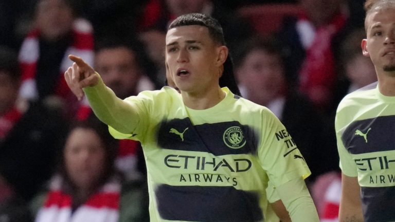 Manchester City's Phil Foden, left, celebrates with his teammates after scoring his side's opening goal during the English FA Cup fifth round soccer match between Bristol City and Manchester City at Ashton Gate stadium in Bristol, England, Tuesday, Feb. 28, 2023. (Kirsty Wigglesworth/AP)