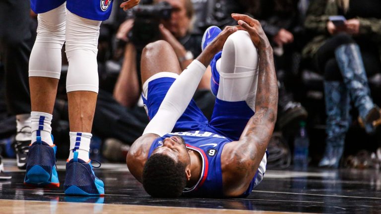Los Angeles Clippers forward Paul George, right, lies on the court after an injury during the second half of an the team's NBA basketball game against the Oklahoma City Thunder on Tuesday, March 21, 2023, in Los Angeles. (Ringo H.W. Chiu/AP Photo)