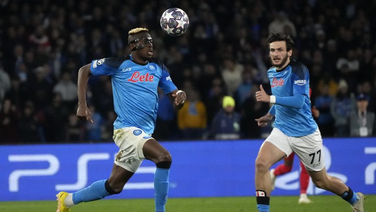Napoli's Victor Osimhen, left, and Napoli's Khvicha Kvaratskhelia run for the ball during the Champions League round of 16 second leg soccer match between SSC Napoli and Eintracht Frankfurt at the Diego Armando Maradona stadium in Naples, Italy, Wednesday, March 15, 2023. (Gregorio Borgia/AP)