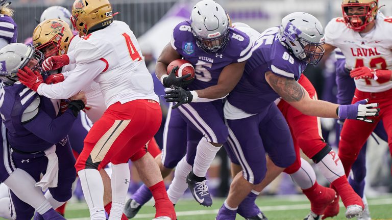 Western’s Keon Edwards runs the ball during the first half of the USports Mitchell Bowl between the Mustangs and the Laval Rouge et Or at Alumni Field at Western University in London, Ont., Saturday, Nov. 19, 2022. (Geoff Robins/CP)