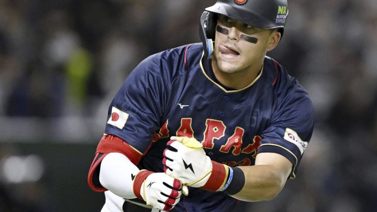Japan team's Lars Nootbaar gestures during a Pool B game against Australia on March 12, 2023, at Tokyo Dome in Tokyo. Nootbaar's pepper-grinder gesture is catching on all across Japan, not just at the Tokyo Dome.(Kyodo News via AP)