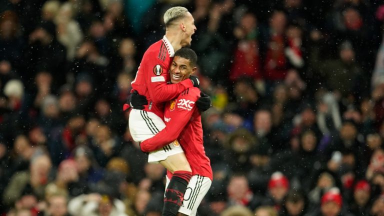 Manchester United's Antony, left, celebrates with Manchester United's Marcus Rashford after scoring his side's second goal during the Europa League round of 16 first leg soccer match between Manchester United and Real Betis at the Old Trafford stadium in Manchester, Thursday, March 9, 2023. (Dave Thompson/AP)