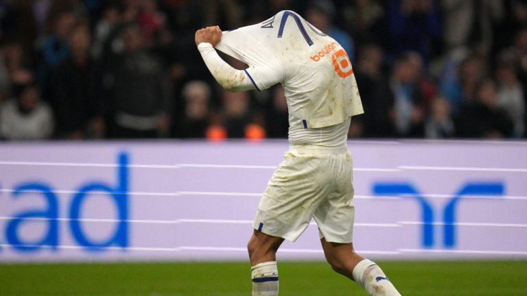 Marseille's Alexis Sanchez reacts during the French League One soccer match between Marseille and Lyon at the Velodrome stadium in Marseille, southern France, Sunday, Nov. 6, 2022. (Daniel Cole/AP Photo)