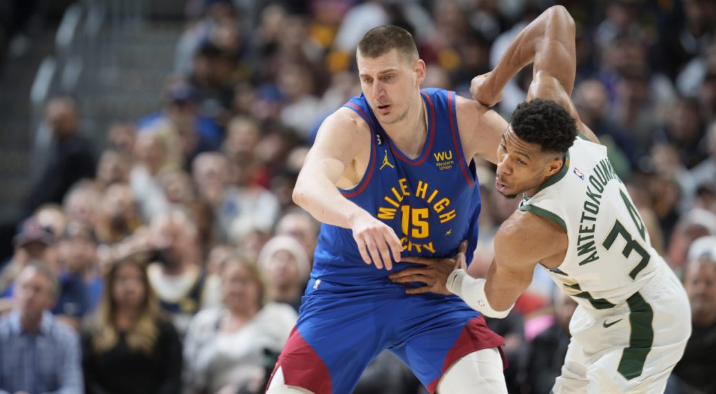 NBA Roundup Conference leaders clash as Nuggets top Bucks behind Jokic