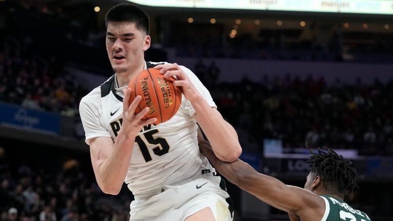 Purdue center Zach Edey (15) grabs a rebound against Michigan State forward Julius Marble II (34) during the second half of an NCAA college basketball game in the semifinal round at the Big Ten Conference tournament, Saturday, March 12, 2022, in Indianapolis. (Darron Cummings/AP)