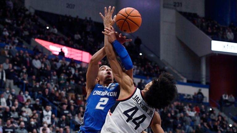 Creighton's Ryan Nembhard (2) tangles with Connecticut's Andre Jackson in the second half of an NCAA college basketball game, Tuesday, Feb. 1, 2022, in Hartford, Conn. (Jessica Hill/AP)