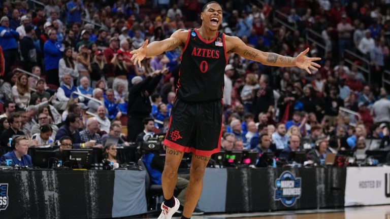 San Diego State forward Keshad Johnson (0) celebrates a win over Alabama in the second half of a Sweet 16 round college basketball game in the South Regional of the NCAA Tournament, Friday, March 24, 2023, in Louisville, Ky. San Diego State won 71-64. (John Bazemore/AP)