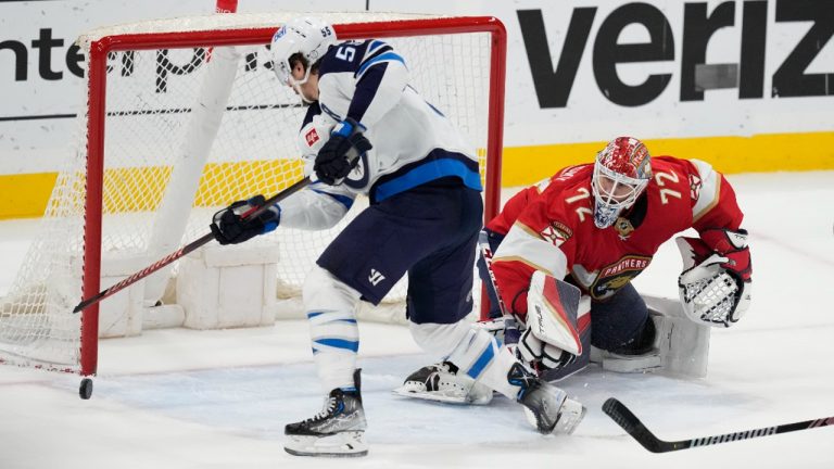 Winnipeg Jets center Mark Scheifele (55) scores the game-winning goal against Florida Panthers goaltender Sergei Bobrovsky (72) as Florida Panthers centre Sam Bennett (9) defends. (AP Photo/Rebecca Blackwell)