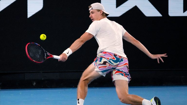 Denis Shapovalov of Canada plays a backhand return to Hubert Hurkacz of Poland during their third round match at the Australian Open tennis championship in Melbourne, Australia, Friday, Jan. 20, 2023. (Dita Alangkara/AP)