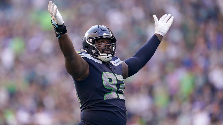 Seattle Seahawks defensive end Shelby Harris gestures toward fans during the second half of an NFL football game against the Arizona Cardinals in Seattle, Sunday, Oct. 16, 2022. (AP)