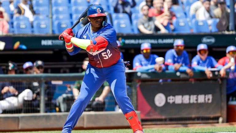 Cuba's Yoenis Cespedes gets a hit during the Pool A game against Netherlands in the World Baseball Classic at Taichung Intercontinental Baseball Stadium in Taichung, Taiwan on Wednesday, March 8, 2023. (I-Hwa Cheng/AP Photo)