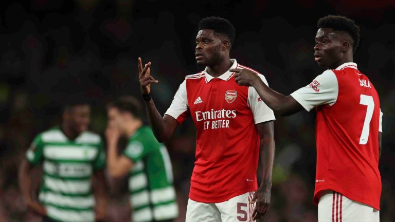 Arsenal's Bukayo Saka, right, and Arsenal's Thomas Partey gesture during the Europa League round of 16, second leg, soccer match between Arsenal and Sporting CP at the Emirates stadium in London, Thursday, March 16, 2023. (Ian Walton/AP Photo)