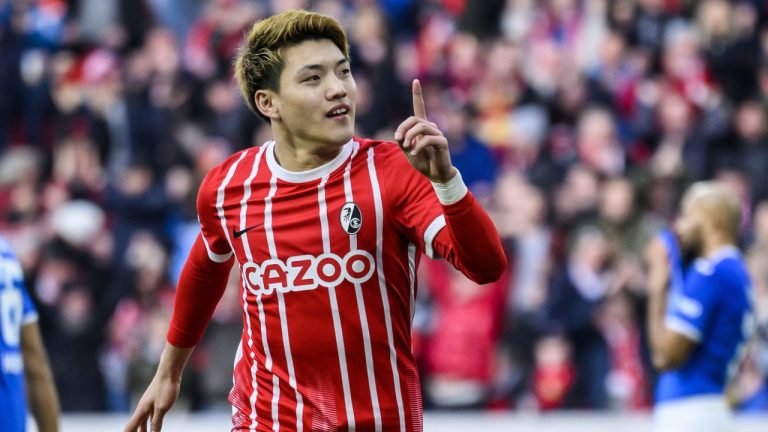 Freiburg's Ritsu Doan celebrates after his goal to make it 2:1 during the German Bundesliga soccer match between TSG 1899 Hoffenheim and SC Freiburg in Freiburg im Breisgau, Germany, Sunday March 12, 2023. (Tom Weller/dpa via AP)