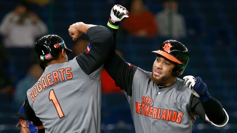 Netherlands' Wladimir Balentien, right, celebrates with teammate Xander Bogaerts at home after hitting a three-run home-run off Cuba's starter Lazaro Blanco during the first inning of their second round game of the World Baseball Classic at Tokyo Dome in Tokyo, Wednesday, March 15, 2017. (Shizuo Kambayashi/AP Photo)