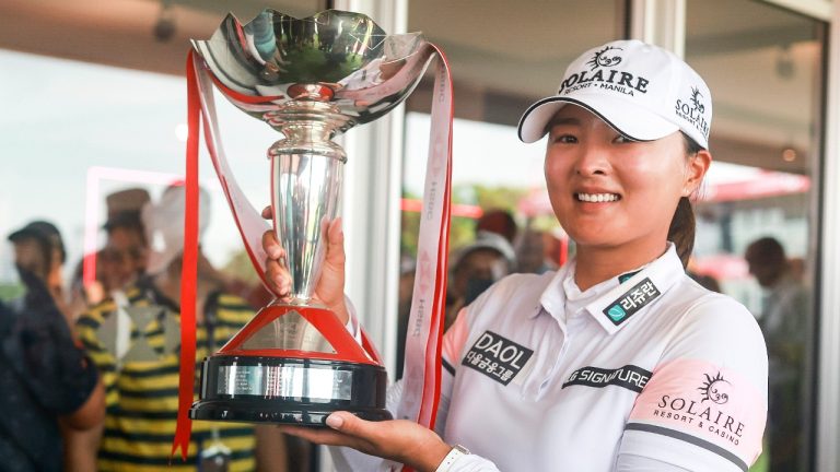 Jin Young Ko of South Korea poses with the trophy after winning the HSBC Women's World Championship at the Sentosa Golf course, in Singapore, Sunday, March 5, 2023. (Danial Hakim/AP)