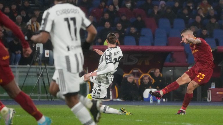 Roma's Gianluca Mancini, right, scores his side's opening goal during the Italian Serie A soccer match between Roma and Juventus at Olympic Stadium, in Rome, Italy, Sunday, March 5, 2023. (Gregorio Borgia/AP)