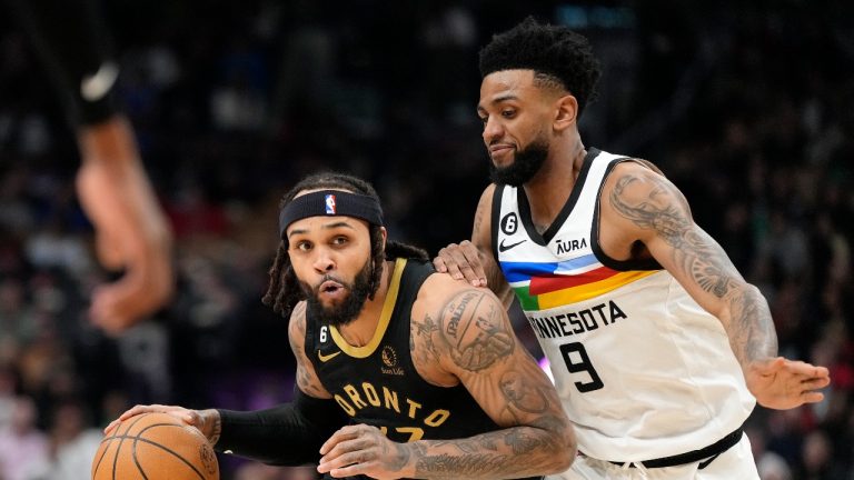 Minnesota Timberwolves guard Nickeil Alexander-Walker (9) tries to pressure Toronto Raptors guard Gary Trent Jr. (33) during first half NBA basketball action in Toronto, Saturday, March 18, 2023. (Frank Gunn/THE CANADIAN PRESS)