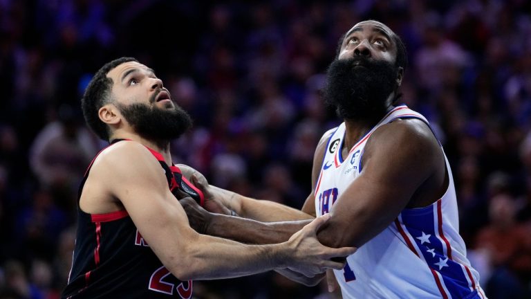 Toronto Raptors' Fred VanVleet and Philadelphia 76ers' James Harden wrestle for position on a rebound during the first half of an NBA basketball game, Monday, Dec. 19, 2022, in Philadelphia. (Matt Slocum/AP Photo)