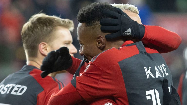 Toronto FC's Mark-Anthony Kaye his congratulated by Federico Bernardeschi after scoring his team's second goal against Inter Miami during second half MLS action. (Chris Young/CP)