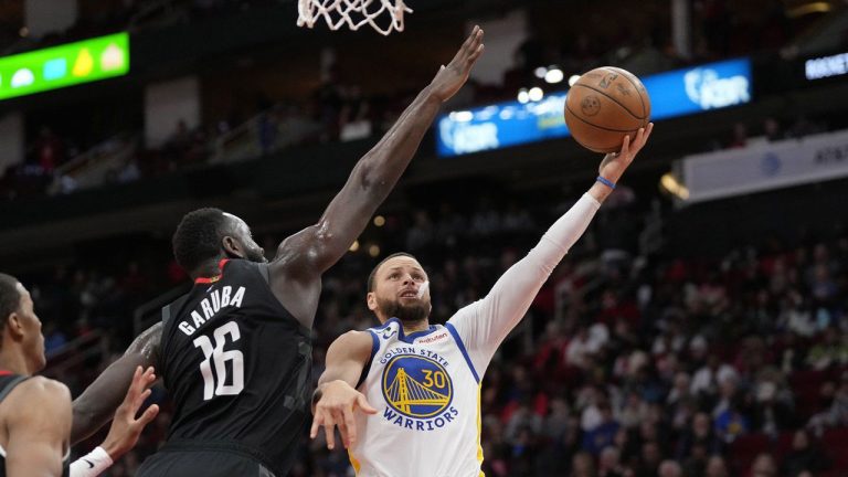 Golden State Warriors' Stephen Curry (30) shoots as Houston Rockets' Usman Garuba (16) defends during the second half of an NBA basketball game. (David Phillip/AP)