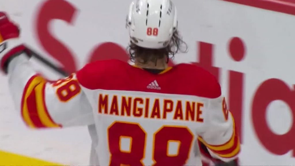 Calgary Flames Right Wing Andrew Mangiapane adjusts his jersey
