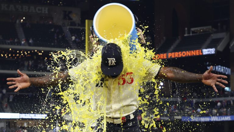 Texas Rangers' Adolis Garcia (53) gets doused with a sports drink after a game against the Oakland Athletics in which he hit three home runs and two doubles during a baseball game on Saturday, April 22, 2023, in Arlington, Texas. (Richard W. Rodriguez/AP)