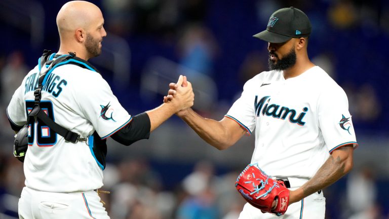 Miami Marlins catcher Jacob Stallings, left, shakes hands with starting pitcher Sandy Alcantara after a baseball game against the Minnesota Twins, Tuesday, April 4, 2023, in Miami. (Lynne Sladky/AP)