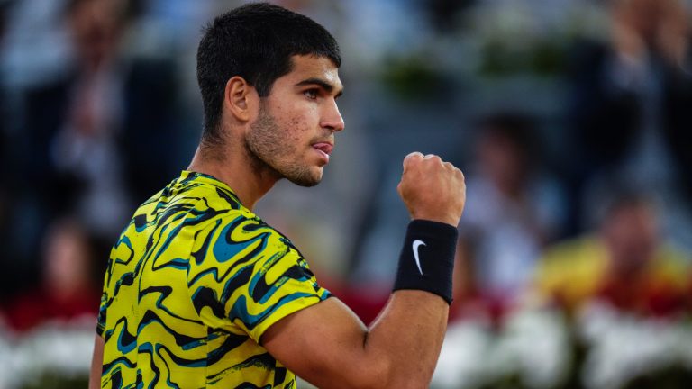 Carlos Alcaraz, from Spain, celebrates his victory over Grigor Dimitrov, of Bulgaria, at the Madrid Open tennis tournament in Madrid, Spain, Sunday, April 30, 2023. (AP)