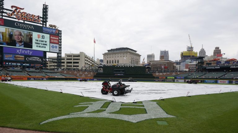 A tarp covers the field at Comerica Park. (Carlos Osorio/AP)