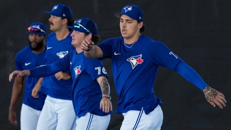 Toronto Blue Jays pitcher Ricky Tiedemann, right, warms up during baseball spring training in Dunedin, Fla., Monday, Feb. 20, 2023. Nathan Denette/THE CANADIAN PRESS