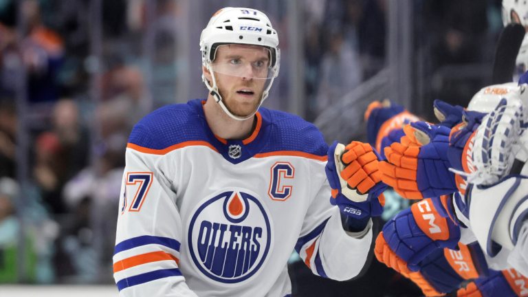 Edmonton Oilers centre Connor McDavid (97) celebrates after his goal against the Seattle Kraken during the third period of an NHL hockey game, Saturday, March 18, 2023, in Seattle. (John Froschauer/AP)