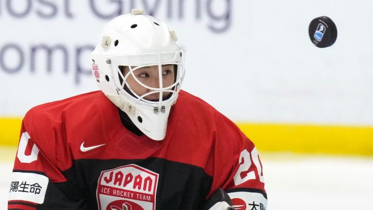 Japan goaltender Miyuu Masuhara (20) eyes the puck while playing against the USA during first period IIHF Women’s World Hockey Championship hockey action in Brampton, Ont., on Wednesday, April 5, 2023. THE CANADIAN PRESS/Nathan Denette