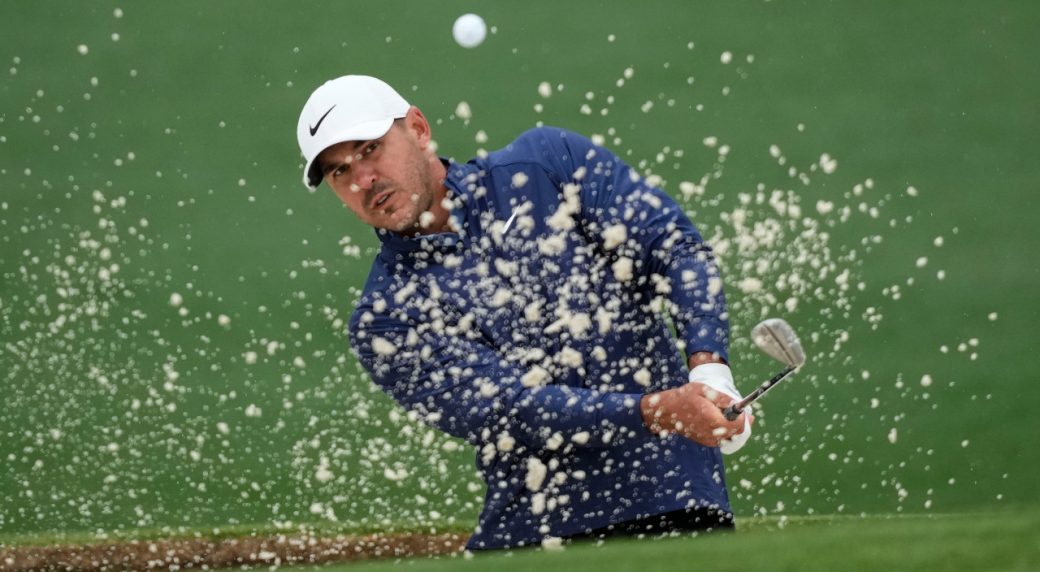 Weather helping Koepka hold on to his Masters lead, with play suspended again