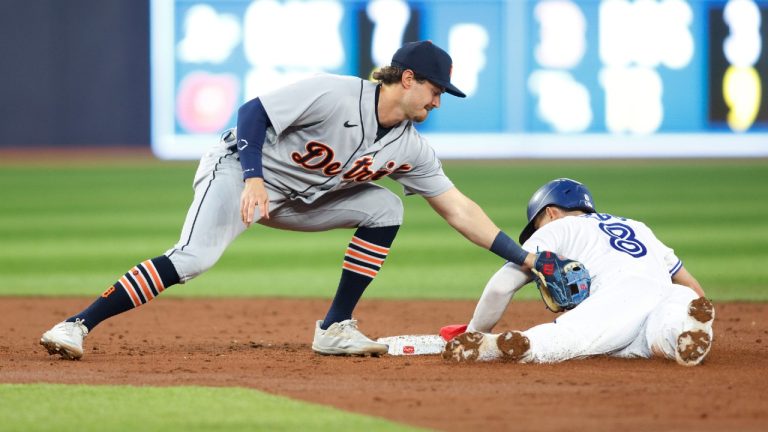 Toronto Blue Jays' Cavan Biggio (8) steals second base ahead of the tag from Detroit Tigers' Zach McKinstry (39) in third inning MLB American League baseball action in Toronto on Thursday, April 13, 2023. Cole Burston/THE CANADIAN PRESS