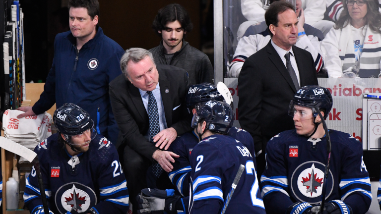 Winnipeg Jets head coach Rick Bowness gives instructions to Dylan Demelo (2) against the Vegas Golden Knights during third period game 4 NHL Stanley Cup first round hockey playoff action in Winnipeg, Monday, April 24, 2023. (CP)