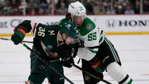 Minnesota Wild right wing Mats Zuccarello, left, and Dallas Stars defenseman Thomas Harley (55) battle for the puck during the first period of Game 6 of an NHL hockey Stanley Cup first-round playoff series Friday, April 28, 2023, in St. Paul, Minn. (AP)