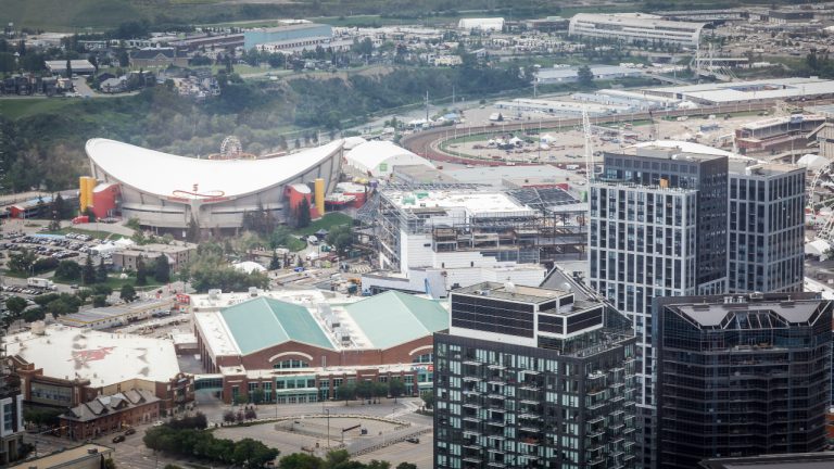A view of the Calgary Stampede grounds and the Saddledome seen from the Telus Sky building in Calgary, Alta., Wednesday, July 6, 2022. (Jeff McIntosh/CP)