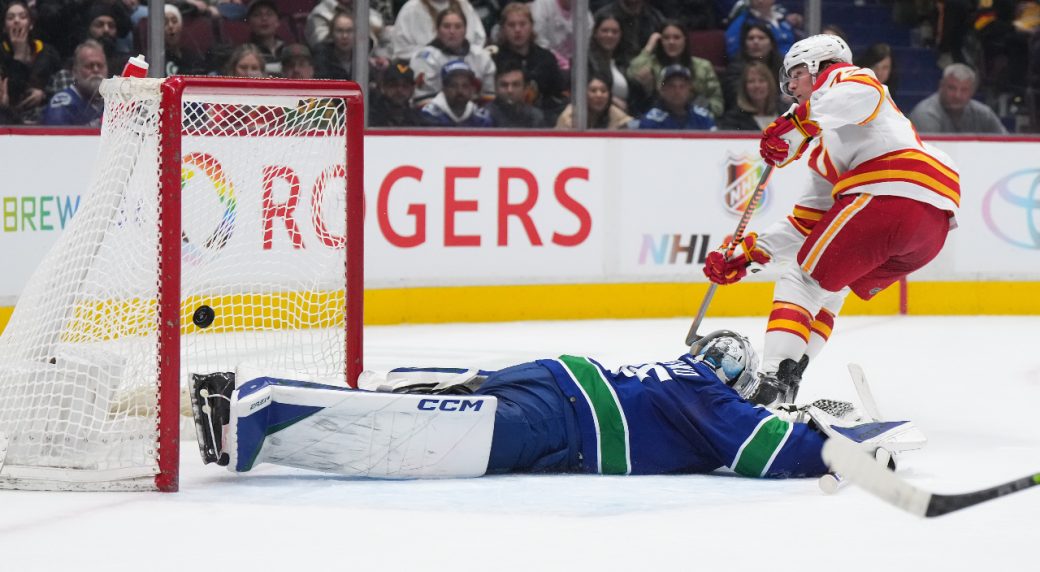 Controversial late penalty costs Canucks an undeserved win over Flames