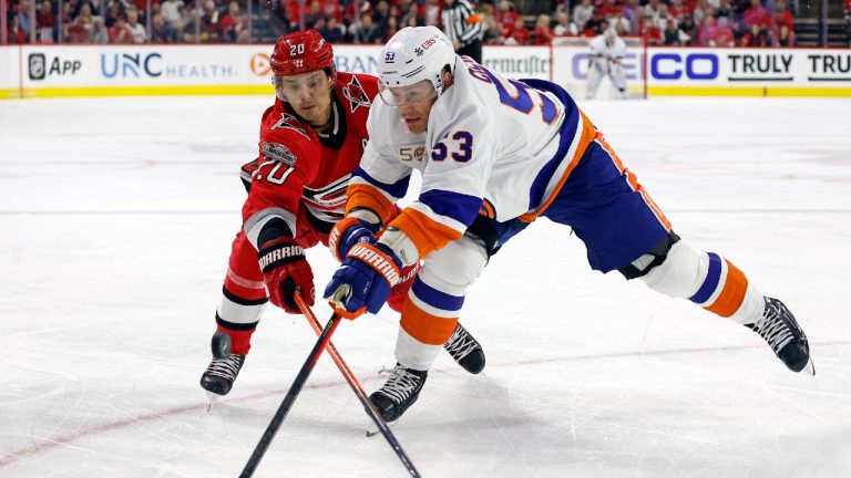 Carolina Hurricanes' Sebastian Aho (20) competes for the puck against New York Islanders' Casey Cizikas (53) during the first period of Game 2 of an NHL hockey Stanley Cup first-round playoff series in Raleigh, N.C., Wednesday, April 19, 2023. (Karl B DeBlaker/AP)