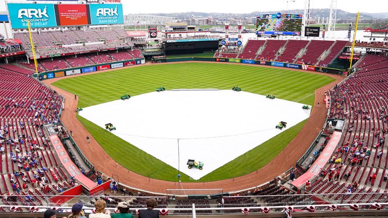 Fans wait during a rain delay before a baseball game between the Chicago Cubs and Cincinnati Reds in Cincinnati, Wednesday, April 5, 2023. (Jeff Dean/AP)