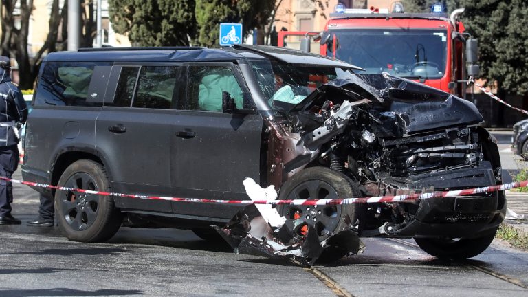 The damaged car of Lazio's soccer player Ciro Immobile lies by the road after crashing, in Rome Sunday, April 16, 2023. Lazio captain Ciro Immobile remains in hospital under observation after his car collided with a tram. Immobile was in the car with his family on Sunday morning when it was involved in a collision with a tram in Rome.  (Roberto Monaldo/LaPresse via AP)