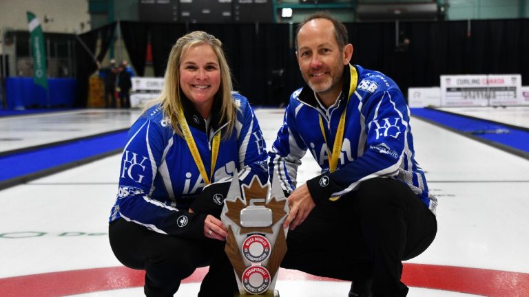 Jennifer Jones and Brent Laing pose with their gold medals and the Canadian Mixed Doubles Curling Championship trophy in Sudbury, Ont., in a March 26, 2023, handout photo. (Duncan Bell/Curling Canada via CP)