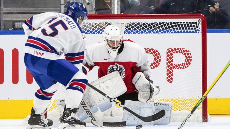 USA's Matthew Coronato (15) scores a goal against Austria's goalie Sebastian Wraneschitz (30) during first period IIHF World Junior Hockey Championship action in Edmonton on Saturday August 13, 2022. (Jason Franson/CP)
