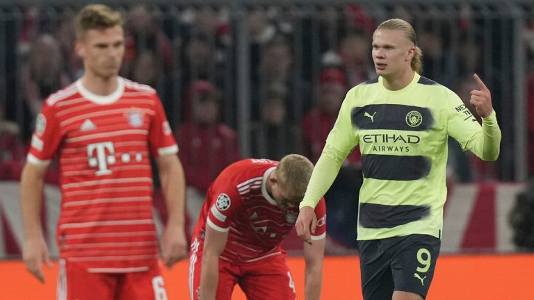 Manchester City's Erling Haaland, right, celebrates after scoring his side's opening goal during the Champions League quarter final second leg soccer match between Bayern Munich and Manchester City, at the Allianz Arena stadium in Munich, Germany, Wednesday, April 19, 2023. (Matthias Schrader/AP)